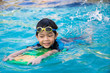 canvas print picture - boy learn to swim in the swimming pool