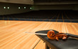 a pegbox of cello with a bow in empty concert hall