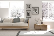 White Room With Sofa And Winter Landscape In Window. Scandinavian Interior Design