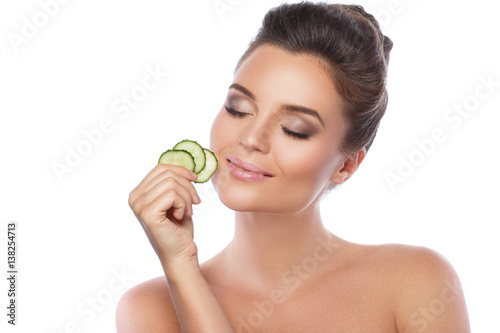 Pinturas sobre lienzo Young beautiful woman with cucumber slices