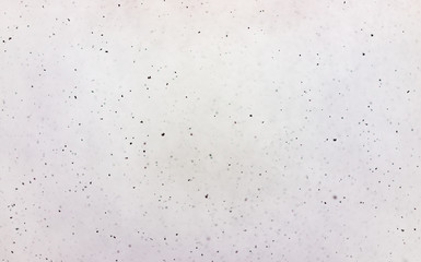 Abstract white background with black speckles of snow