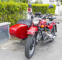 PISA, ITALY - MARCH 2014: Sidecar parked in a city street. Sidecar is used by many passionate people to travel in Tuscany