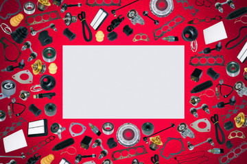 Spare auto parts car on the red background set. Frame for advertising and assembled from auto parts, spare parts. Many repair part are located on the edge of the image. OEM.