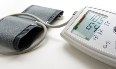 Wall Mural - Digital blood pressure mesuring device on white