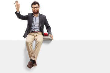 Poster - Male teacher sitting on a panel and waving