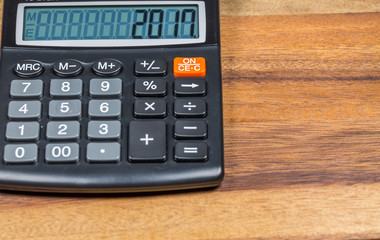 calculator on wood table