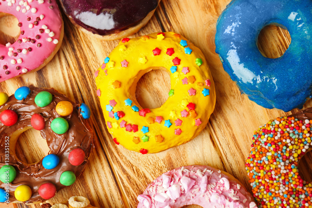 Glazed donuts on wooden background