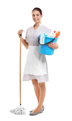 Wall Mural - Hotel female chambermaid holding cleaning supplies on white background