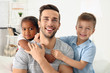 © Africa Studio - Happy father with interracial children