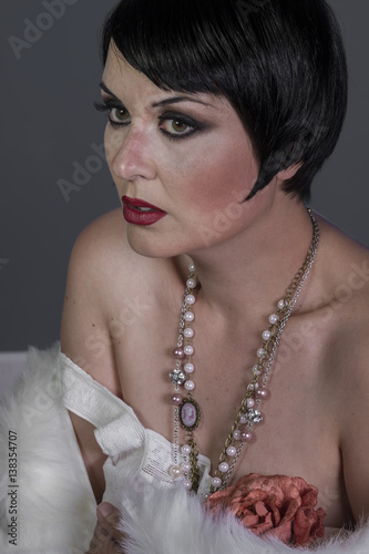 1920s Style Brunette Dancer With Short Hair And Jewelry She Is