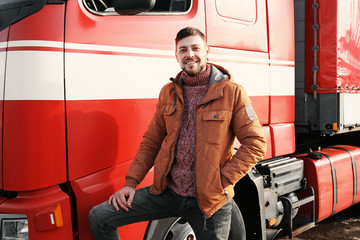 Wall Mural - Handsome driver near big modern truck outdoors