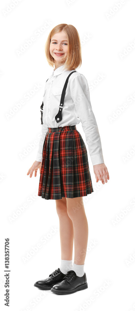 Cute girl in school uniform on white background