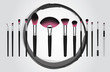 Vector illustration concept of a set of makeup cosmetic brushes with Grundge pink brush stroke circle on background.