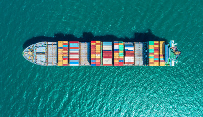 Wall Mural - container ship in import export and business logistic.By crane ,Trade Port , Shipping.cargo to harbor.Aerial view.Top view.