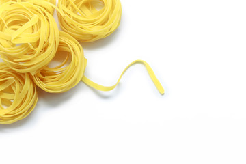 Italian fettuccine pasta isolated on white background