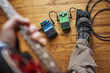 © goodmanphoto - a person playing a guitar and using effect pedals