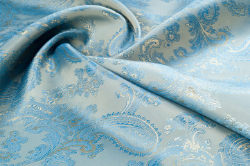 Fabric silk texture, background. Blue patterned