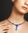 © looking2thesky - Jewellery and accessories. Elegant fashionable woman with jewelry. Beautiful woman with sapphire necklace. Young beauty model with sapphire pendant. Fashion and beauty salon. Perfect lip makeup
