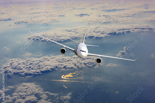 airliner-flying-above-clouds-passenger-airplane