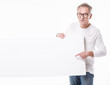 © neonshot - Senior beautiful man with empty white board.