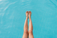 Cropped Image Of Legs Woman Near The Pool
