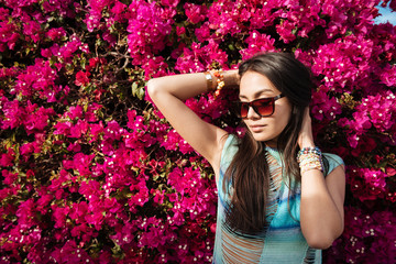 Canvas Print - Woman posing near the flower bush