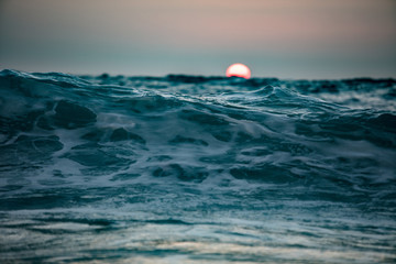 Wall Mural - sun is going down in ocean