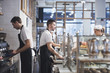 © LUMINA IMAGES - Bartenders and waitress working at coffee shop.