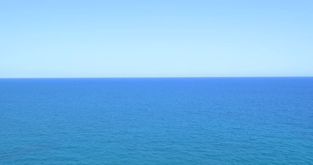 Wall Mural - Calm Ocean Water And Clear Blue Sky