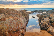 Beautiful Seascape With Sea And Rock In Nang Thong Beach, Khao Lak, Thailand. Tropical Colourful Sunset And View Of Dark Night Sea With Protruding Stones