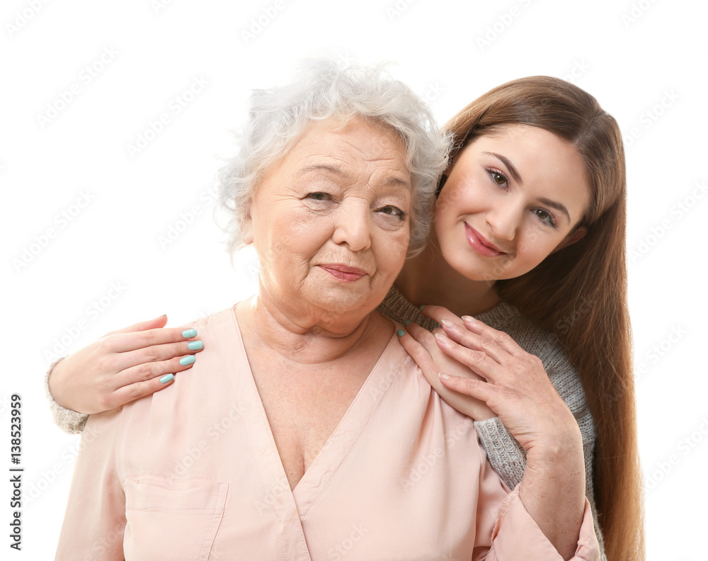 Beautiful girl with grandmother on white background