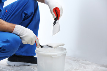 Wall Mural - Professional worker making repair in room