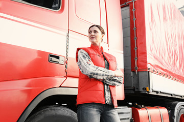 Wall Mural - Young female driver near big modern truck outdoors