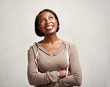 © grinny - Thinking smiling african woman