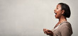 © grinny - Happy surprised black woman profile