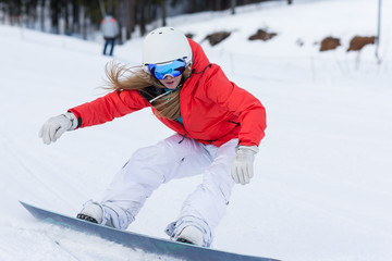 Wall Mural - Ssnowboarder on slopes in the sunny morning