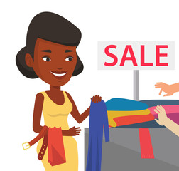 Canvas Print - Young woman choosing clothes in shop on sale.