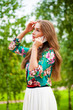 © Andrey_Arkusha - Beautiful young brunette woman calling by phone