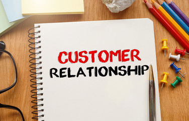 Poster - notebook with toolls and notes about customer relationship