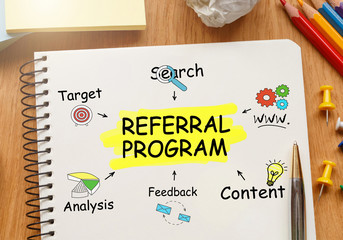 Poster - notebook with toolls and notes about referral program