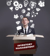 © Egor - Business, Technology, Internet and network concept. Young businessman shows the word: Inventory management