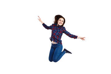 Young woman jumping on white background 