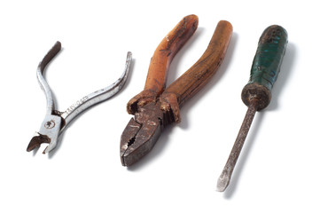 Old vintage tools, pliers, screwdriver and nippers close-up isolated on white background 