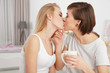 Morning of young lesbian couple at home