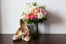Bride`s Wedding Accessories: Wedding Shoes, Rings And Bouquet Or Boutonniere With Pink And White Flowers 