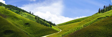 Panoramic Landscaped Hills With Blue Sky And White Clouds
