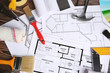 © Africa Studio - Decorator workplace with house project and tools, closeup