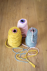 Wall Mural - Pink, Yellow, and Gray Yarn in Individual Spools