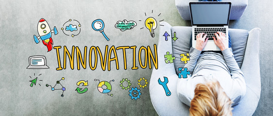 Wall Mural - innovation text with man using a laptop