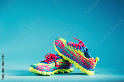Fotografía Colorful running sneakers on a blue background